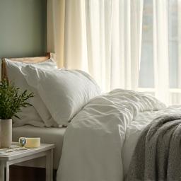 Serene bedroom with soft lighting, representing sleep and recovery