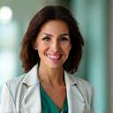 Professional headshot of Dr. Elena Rodriguez, a confident and compassionate functional medicine specialist.