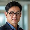 Professional headshot of Professor David Chen, a knowledgeable and approachable wellness researcher and sleep expert.