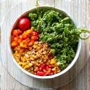 A vibrant bowl of fresh, colorful fruits and vegetables, depicting balanced nutrition and well-being